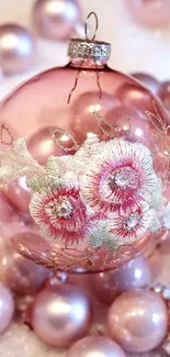 Pink floral ornament on soft pastel background.