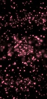 Elegant glowing pink particles on a dark background mobile wallpaper.