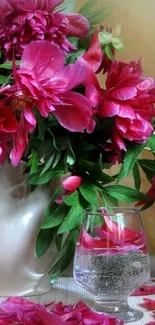 Elegant pink peonies in a white vase.