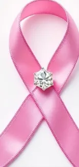 Pink ribbon with diamond accent on light background.