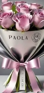 Elegant bouquet of pink roses with silver wrap.