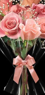 Beautiful bouquet of pink roses with baby breath and satin ribbon.