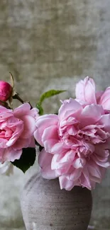 Vase with delicate pink roses on soft background.