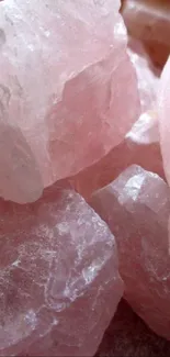 Close-up of pink rose quartz stones for a stylish phone wallpaper.