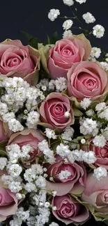 Elegant bouquet of pink roses with white flowers on dark background.