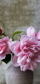 Elegant pink roses in a rustic vase wallpaper.