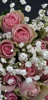 Bouquet of pink roses with white flowers.