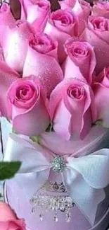 A bouquet of pink roses with a white bow mobile wallpaper.