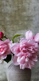 Elegant mobile wallpaper featuring pink roses in a rustic vase.