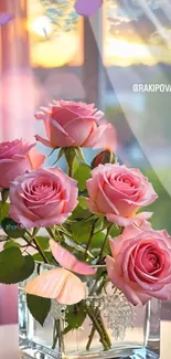 Pink roses in a crystal vase by a sunlit window.