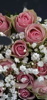 Vibrant pink roses and white baby's breath bouquet.