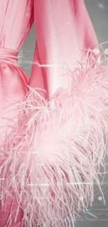 Luxurious pink satin fabric with soft feathers.