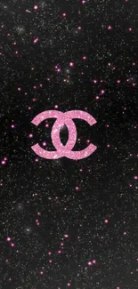 Pink sparkle logo on black starry wallpaper.