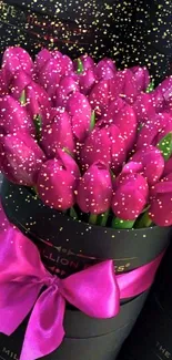 Elegant bouquet of pink tulips in a black box with ribbon.