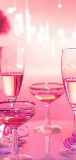 Elegant pink wine setting with bottle and glasses.