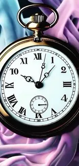 Pocket watch on a pastel swirl background.