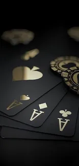 Black and gold poker cards and chips on a dark background