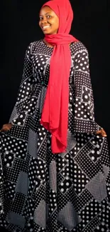 A woman in a polka dot dress with a red scarf on a black background.