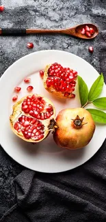 Pomegranate on a white plate with dark background.