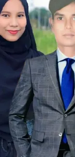 Man in gray suit and woman in hijab in a stylish mobile wallpaper.