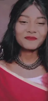 Portrait of a woman wearing a red saree with a charming smile and traditional elegance.