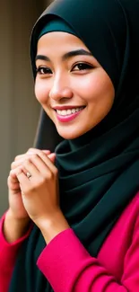 Woman in vibrant pink attire with a warm smile and soft bokeh background.