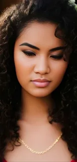 Elegant portrait of a person with curly hair and a necklace.