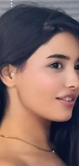 Elegant portrait of a woman with a serene expression.