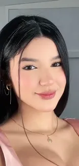 Elegant woman with soft smile posing.