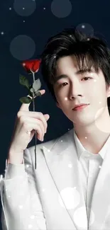 Elegant person in white suit holding red rose.