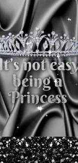 Elegant black wallpaper with a tiara and princess quote.