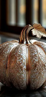 Elegant pumpkin art with gold detailing.
