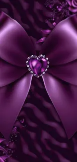 Elegant purple bow with heart centerpiece on satin background.