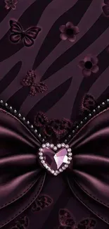 Luxurious purple wallpaper with bow and jeweled heart design.