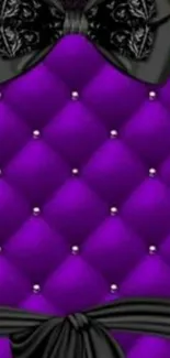 Purple quilted wallpaper with black bow design.