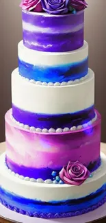 Elegant purple tiered cake with floral accents on a smooth backdrop.