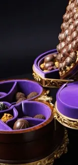 Luxury chocolates in a purple and gold box with velvet interior.