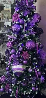 Purple Christmas tree with ornaments.