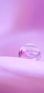 Minimalist purple wallpaper with a single droplet.