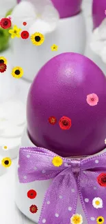 Purple egg with white flowers and ribbon, elegant Easter design.