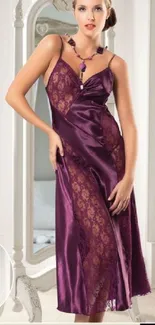 Woman in elegant purple evening gown with lace details.