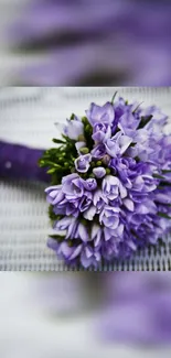 Mobile wallpaper with a purple floral bouquet.