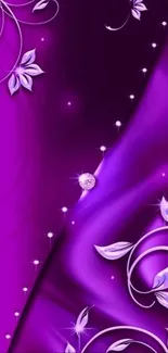 Purple floral wallpaper with elegant swirls and flower accents.