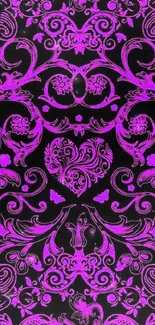 Intricate purple floral pattern on black background.