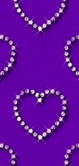 Purple wallpaper with heart-shaped gem design.