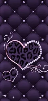 Elegant purple quilted wallpaper with hearts and leopard pattern.