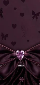 Purple bow with heart and butterfly design wallpaper.
