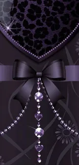 Elegant purple heart wallpaper with bow and jewels.