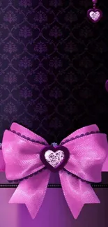 Elegant wallpaper with purple hearts and pink bow design.