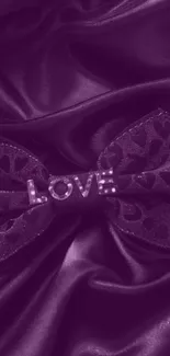 Purple satin wallpaper with love bow.